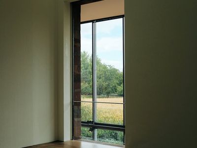 View of a calm, empty yoga studio with natural light.